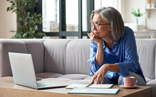 Business_owner_looking_through_leakage_information_1500x936