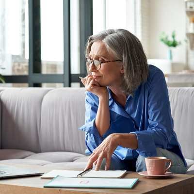 Business owner looking through leakage information