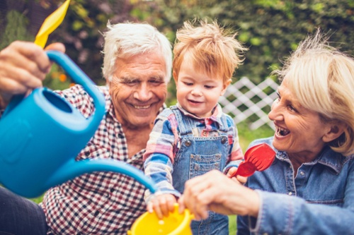 Family with a watering can