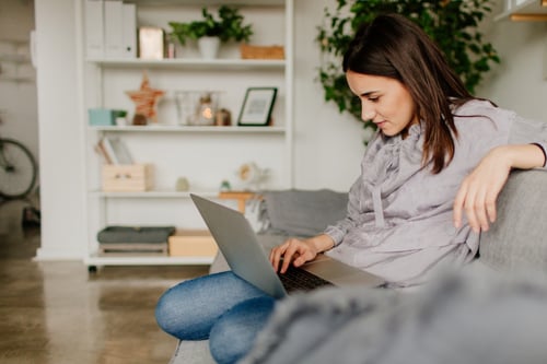 Young woman using a computer at home